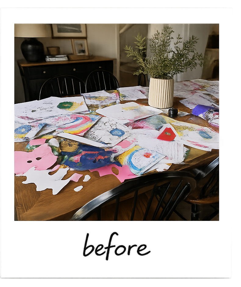 A dining table covered in loose children's artwork before the purge